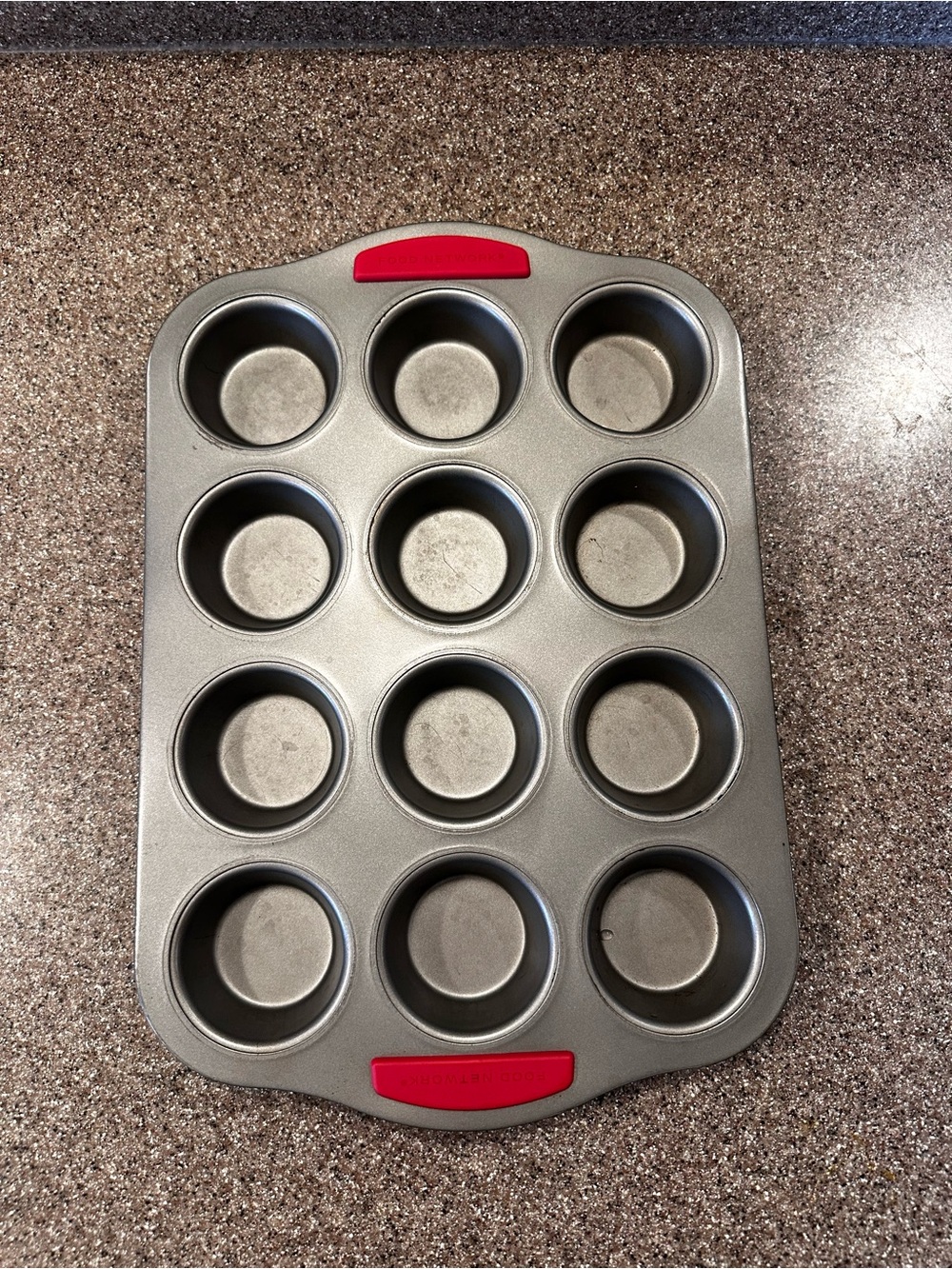 Food Network 12-Cup Gray Muffin Pan with Red Silicone Grips